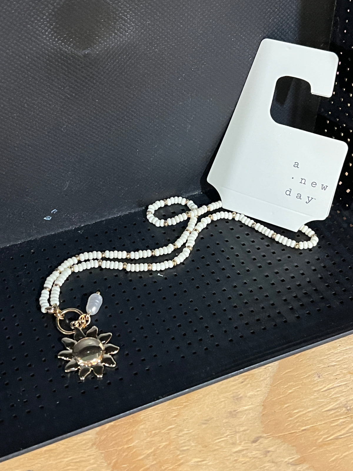 A New Day White Beaded Sun Pendant Necklace photo 1